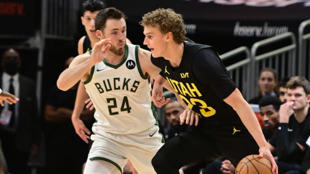 Jan 8, 2024; Milwaukee, Wisconsin, USA; Utah Jazz forward Lauri Markkanen (23) drives for the basket against Milwaukee Bucks guard Pat Connaughton (24) in the fourth quarter at Fiserv Forum.
